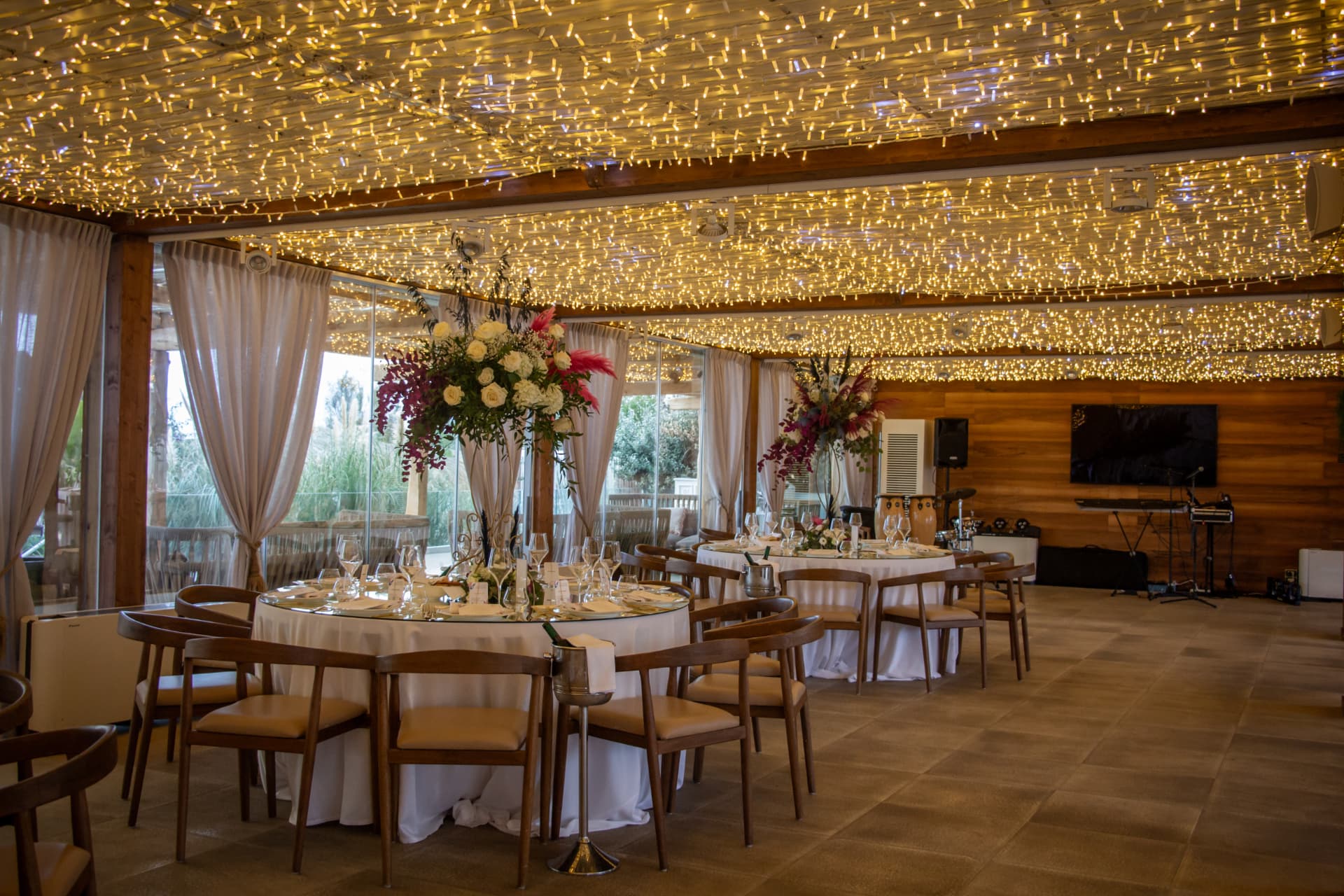 Wedding reception beneath a ceiling of fairy lights