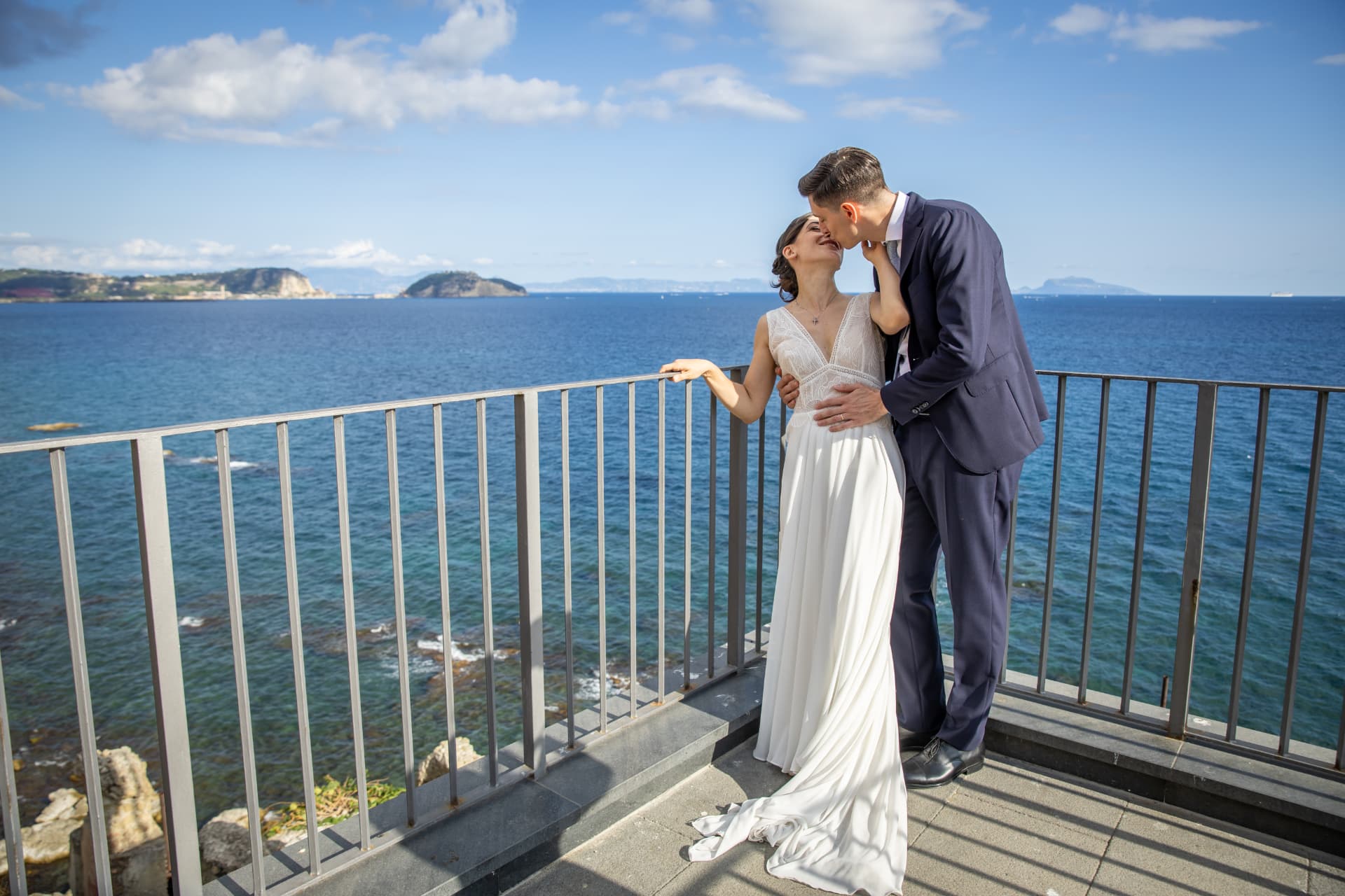 Newlyweds embracing on a panoramic terrace