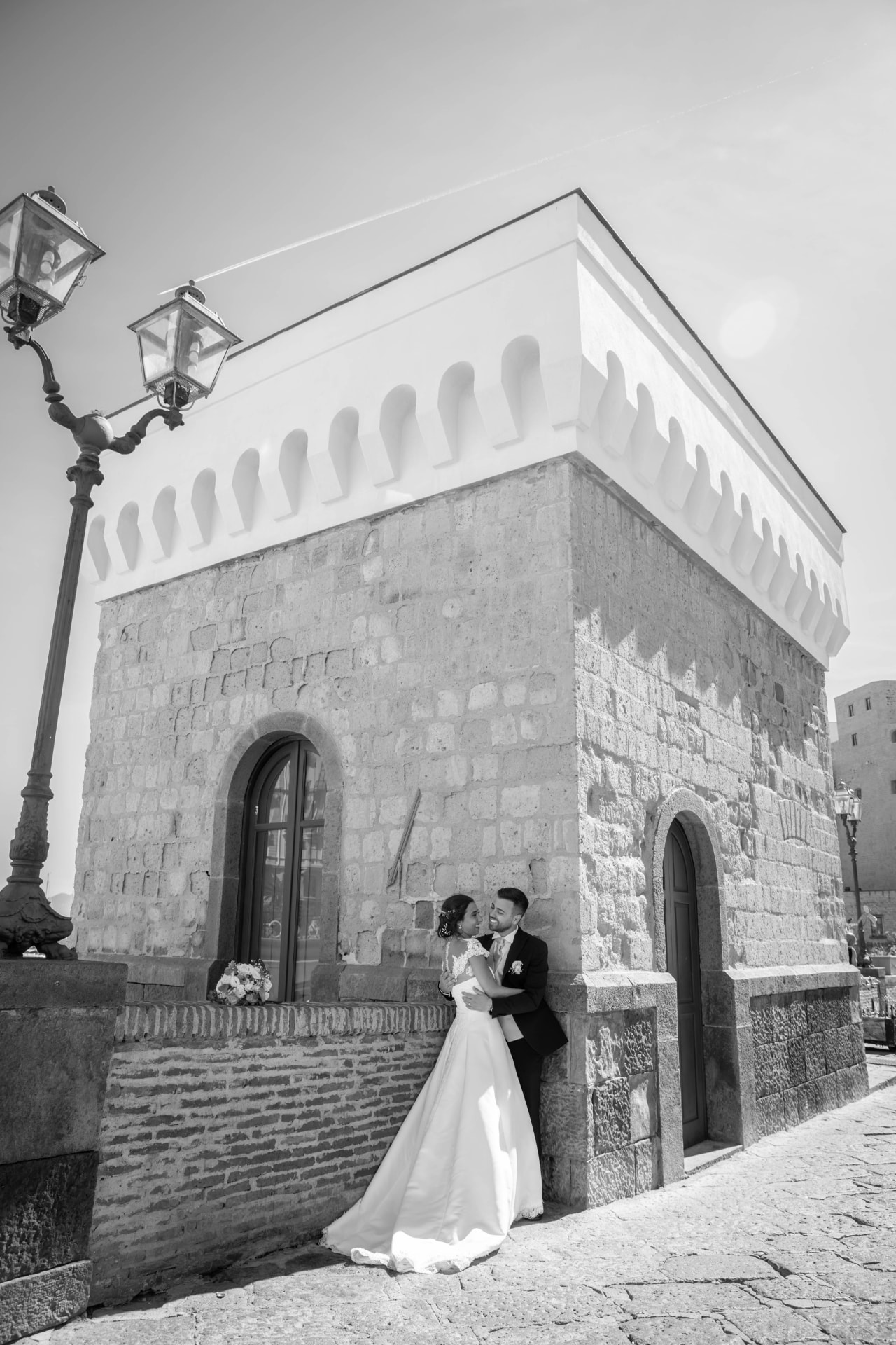 Bride laughing with her father in a Tuscan vineyard