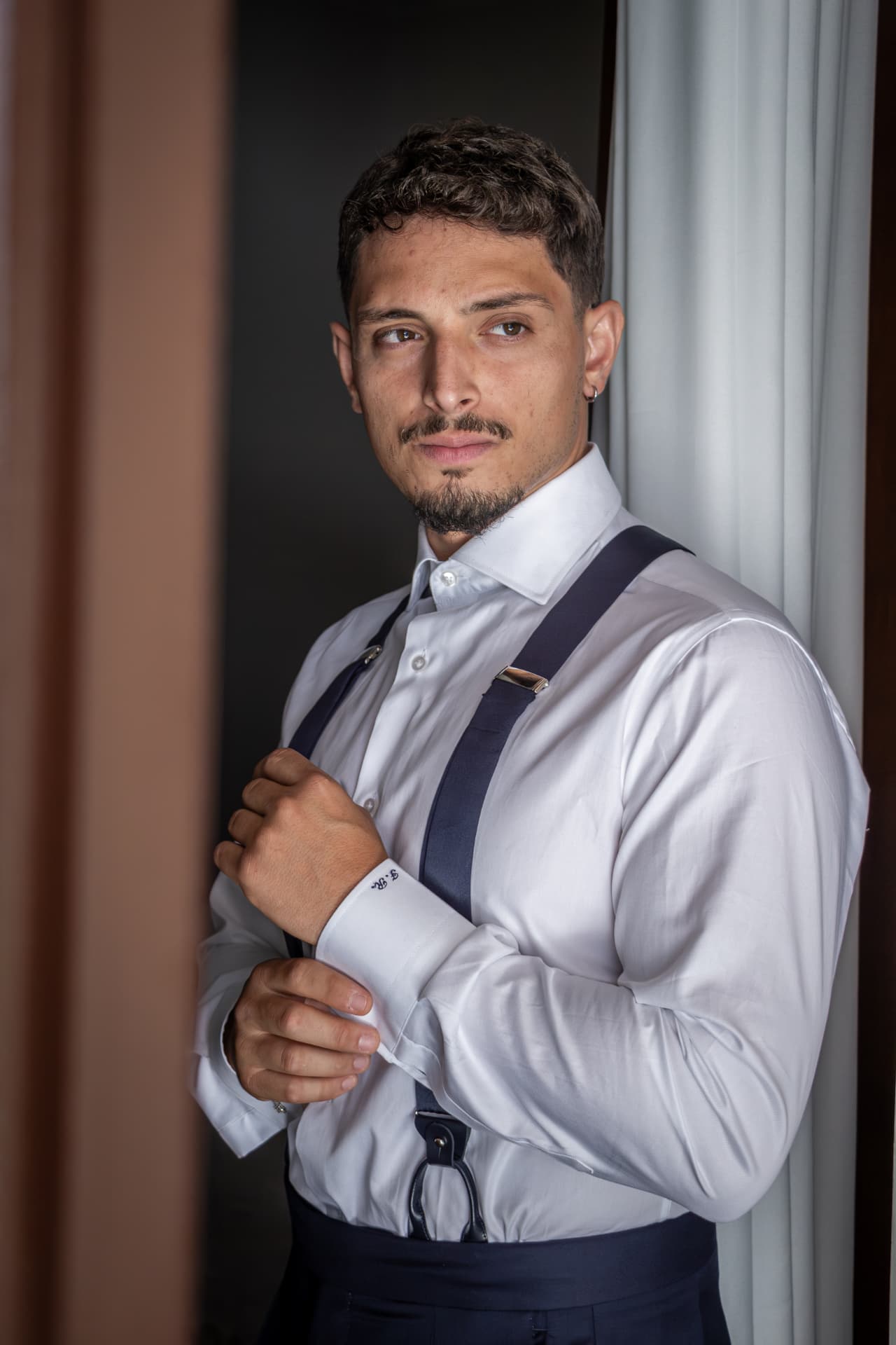 Portrait of a groom preparing for his wedding